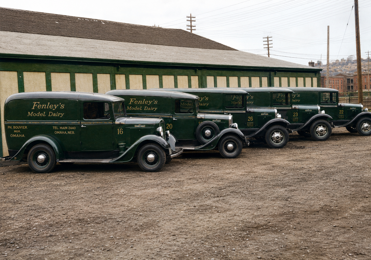 A row of vintage Fenley Dairy delivery trucks, mid-twentieth century.